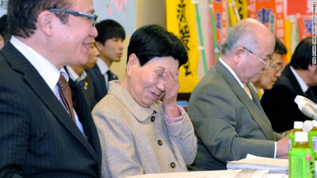 Hideko Hakamada, center, sheds tears of joy after the court ruling.