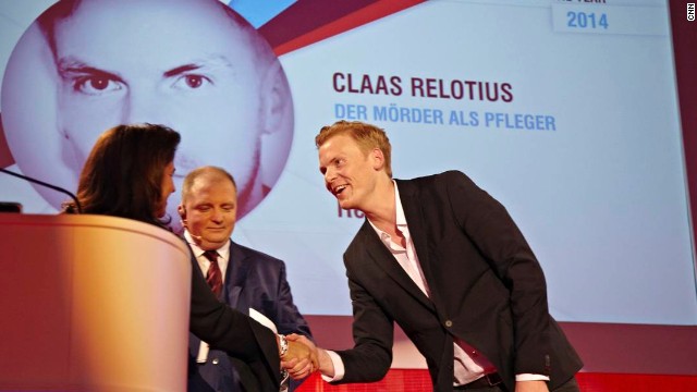 Claas Relotius is awarded the CNN Journalist of the Year 2014 accolade by Parisa Khosravi, senior vice president for CNN Worldwide.