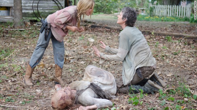 Among the most shocking deaths this season was that of young Lizzie (Brighton Sharbino, left), who died at the hands of Carol (Melissa Suzanne McBride, right) after killing her younger sister Mika. Lizzie's sense of right and wrong and life and death had been warped by the zombie apocalypse. Just as she did earlier in the season, Carol had to make the decision that someone was too dangerous to live. Carol urged Lizzie to follow her therapy of "look at the flowers" before she shot her in the back of the head.