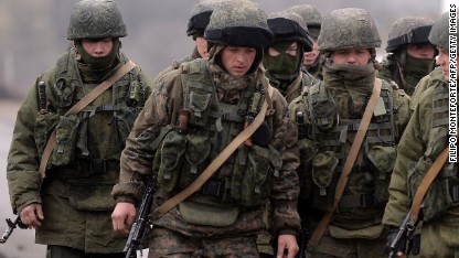 Putin orders troops 'away from border'