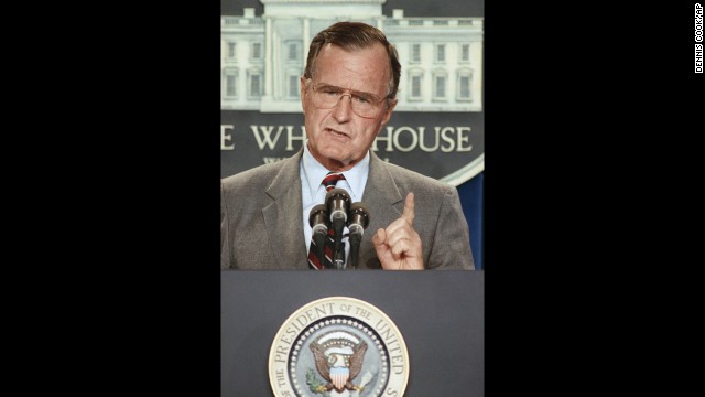 Bush holds a White House news conference in August 1990 during the run-up to war with Iraq.