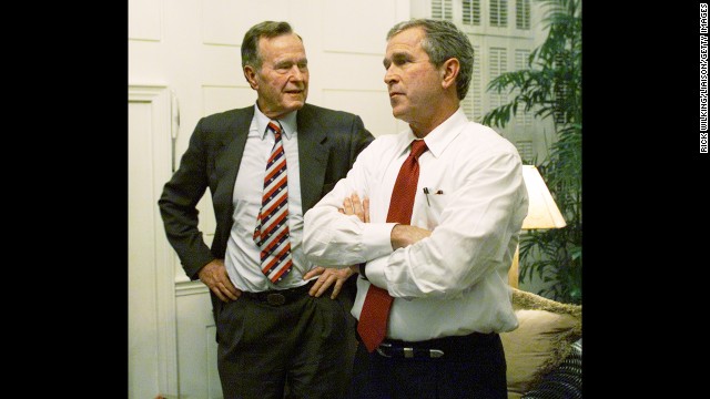 Bush watches election returns with his son, George W. Bush, in Austin, Texas, on November 7, 2000. George W. Bush went on to win the presidential election over Democrat Al Gore, but only after a lengthy recount.