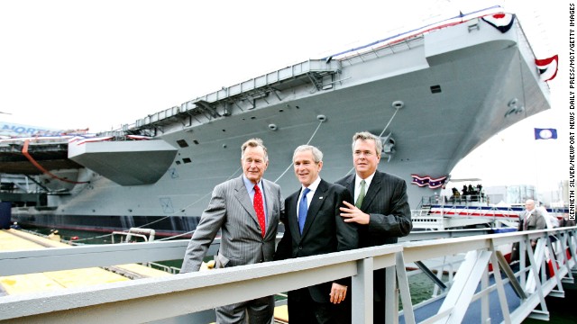 At the christening ceremony of the USS George H.W. Bush in 2009, the 41st President poses for a picture with two of his sons: former President George W. Bush and former Florida Gov. Jeb Bush.