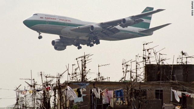 Planes landing at Hong Kong's nearby airport, Kai Tak, often roared overhead.