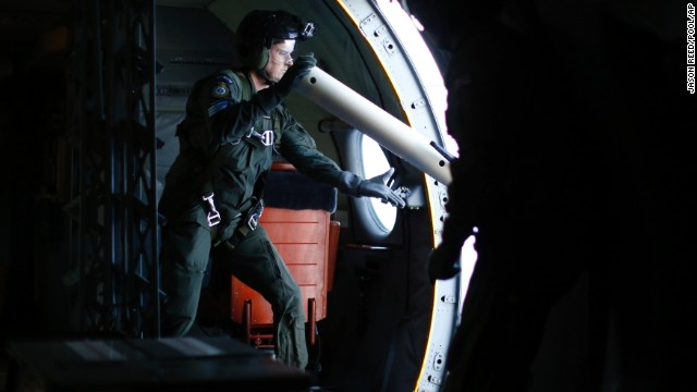 A Royal New Zealand Air Force member launches a GPS marker buoy over the southern Indian Ocean on March 29.