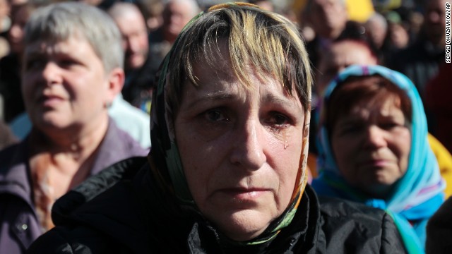 A woman cries Sunday, March 30, during a gathering to honor those who were killed during protests in Kiev's Independence Square.