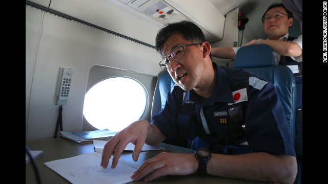 Kojiro Tanaka, head of the Japanese coast guard search mission, explains the efforts en route to the search zone April 1.