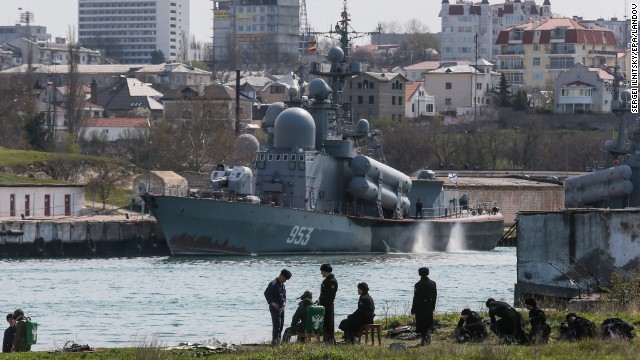 Russian soldiers prepare for diving training in front of a Tarantul-III class missile boat Tuesday, April 1, in Sevastopol.