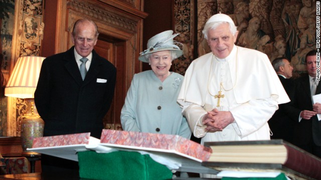 The Queen, accompanied by her husband, Prince Philip, exchanges gifts with Pope Benedict XVI in Edinburgh, Scotland, in September 2010.