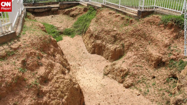 A preserved mass grave at Murambi Genocide Memorial serves as a stark reminder of the atrocities of genocide and the oft-quoted pledge, "Never again."