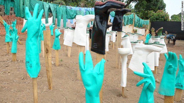 Gloves and boots used by medical staff, drying in the sun, at a center for victims of the Ebola virus in Gueckedou, Guinea.