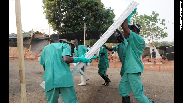 Health specialists work Monday, March 31, at an isolation ward for patients at the facility in southern Guinea.