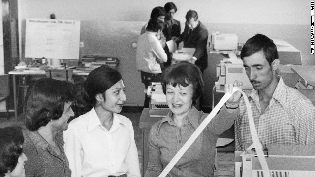Male and female Afghan students studying computing technology sit together and listen to a female Soviet teacher (center) in the Computing Center of the Polytechnical Institute in Kabul in 1981. The Soviet Union had invaded the country in December 1979.