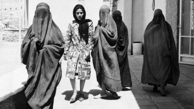 Taken in 1962, this picture shows Afghan women walking along a street in Kabul. Four of them are wearing burqas, whereas one walks comfortably among them in European-style dress. "When the mujahideen-led government replaced the Soviets in 1992, new restrictions on dress were formalized," says Mosadiq, "and obviously the Taliban's takeover in 1994 was the final nail in the coffin for any kind of independent dress for both men and women."