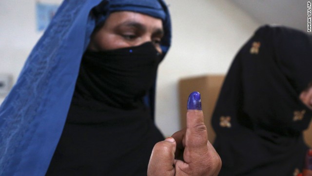 Afghan women show inked fingers after casting their votes at a polling station in Jalalabad, Afghanistan, on April 5. Despite threats from the Taliban to disrupt the vote and punish all involved, Afghans remain enthusiastic about the election. The top presidential contenders are Ashraf Ghani, Abdullah Abdullah and Zalmai Rassoul. The winner will replace President Hamid Karzai.