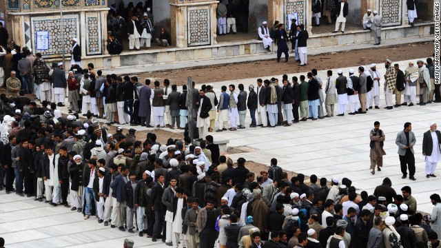 Afghans wait in long lines for their chance to cast a vote. 