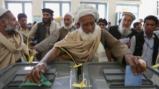 An Afghan man casts his vote at a polling station in Jalalabad on Saturday, April 5. A heavy security presence across the country ensured that the vote went largely smoothly, although some attacks were reported.