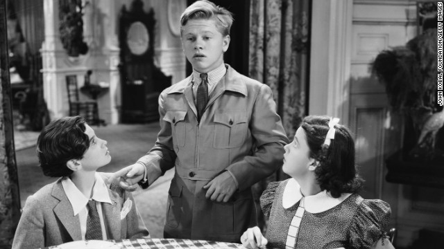 Mickey Rooney stars with Judy Garland and Ronald Sinclair in a scene from the comedy "Thoroughbreds Don't Cry." 