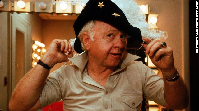 Rooney tries on a feathered hat in his dressing room during a run of the play "Sugar Babies" in October 1979. He was nominated for a Tony for the role. 