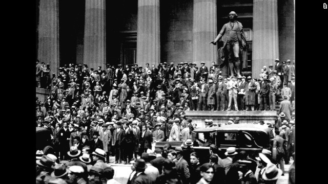 People gathered across from the New York Stock Exchange on "Black Thursday," October 24, 1929. The stock market crash of 1929, fueled by excessive speculation on Wall Street, set off the Great Depression. 