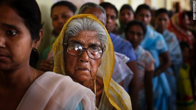 Indians in Dibrugarh stand in a line to cast their vote on April 7.