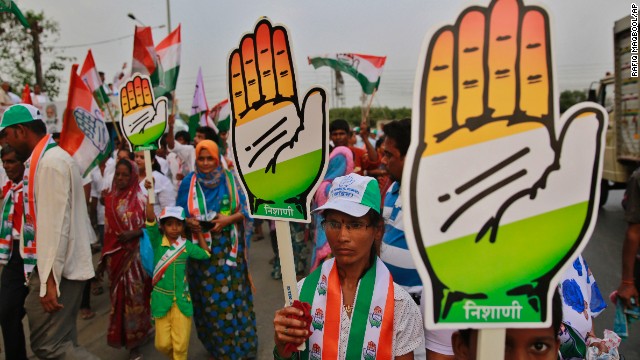 Supporters of India's ruling Congress Party carry the "hand" party symbol during an election rally in Mumbai on April 7. 