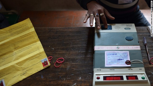 A polling official in Dibrugarh tests an electronic voting machine prior to the start of voting April 7.