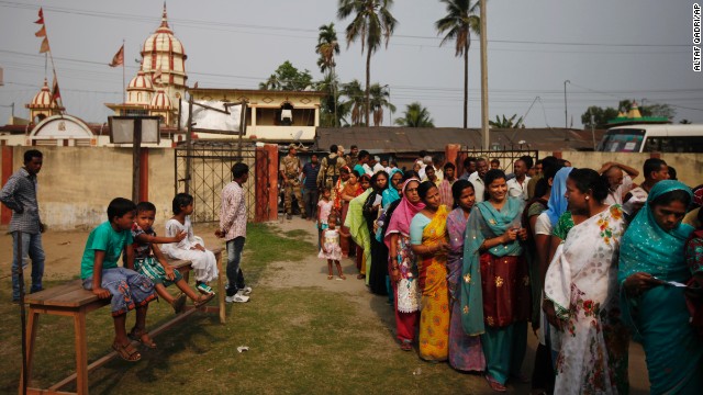 People wait in line to cast their votes during the first phase of voting in Dibrugarh.