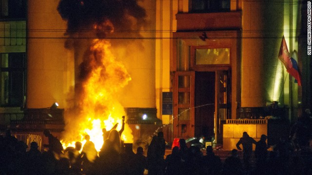 Pro-Russian protesters burn tires near a regional administration building in Kharkiv after police cleared the building on Monday, April 7.