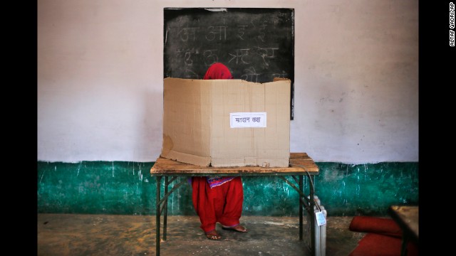 A woman casts her vote in Muzaffarnagar, India, on Thursday, April 10. India's general election is being held in stages over five weeks. Voters will elect 543 members to the lower house of parliament, which will then select the country's next prime minister. Prime Minister Manmohan Singh is stepping aside after a decade in charge.