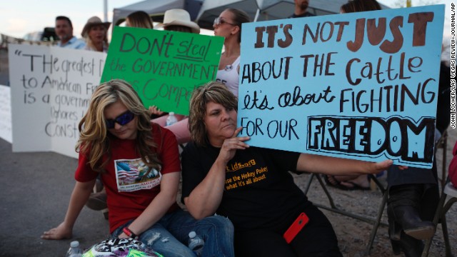 Krissy Thornton, right, and Burgundy Hall are among those protesting the U.S. government's roundup of a rancher's cattle near Bunkerville, Nevada, on Wednesday, April 9. A 20-year dispute between Nevada rancher Cliven Bundy and federal rangers erupted into an Old West-style showdown this week. The government says Bundy's livestock has been illegally grazing on U.S. lands for 20 years. Bundy says his family's cattle has grazed on the land since the 1800s.