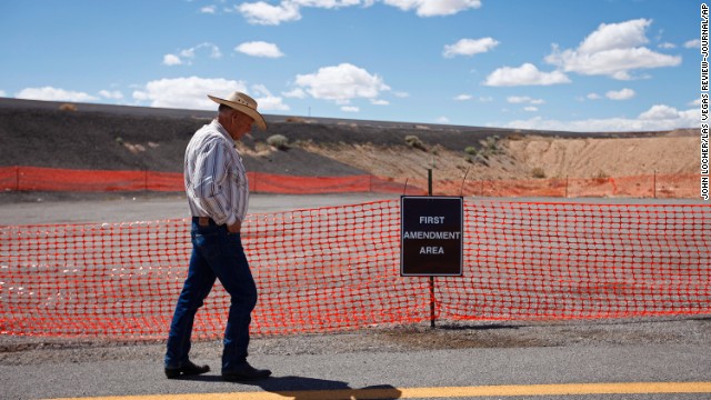 Bundy walks by a free speech area set up by the Bureau of Land Management on Tuesday, April 1.