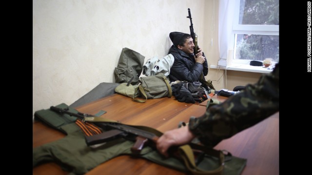 Armed pro-Russian protesters occupy the Security Service building in Luhansk on April 10.