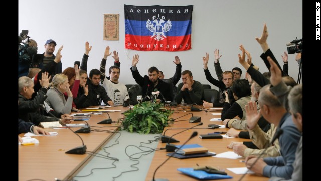 Members of the self-proclaimed government the "Donetsk Republic" vote April 10 during a meeting at the seized regional administration building in Donetsk.