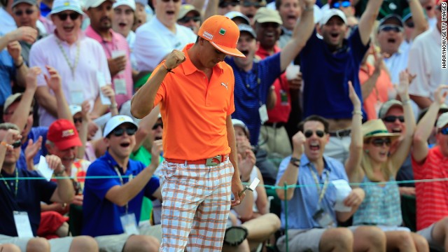 Resplendent in orange, Rickie Fowler milks the applause of the crowd after holing a monster putt on the ninth in the final round.