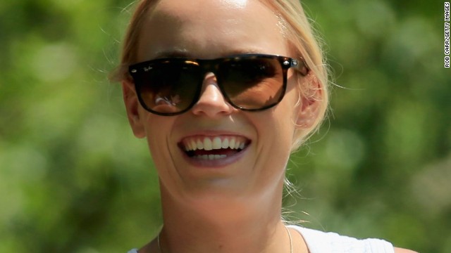 Rory McIlroy's fiancee, tennis star Caroline Wozniacki, had something to smile about on the last day as he carded a fine three-under-par 69 to finish level par for the tournament.