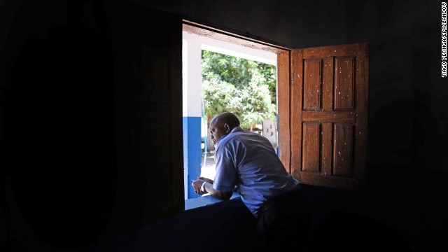 A Guinea-Bissau customs official watches arrivals from Conakry on Tuesday, April 8.