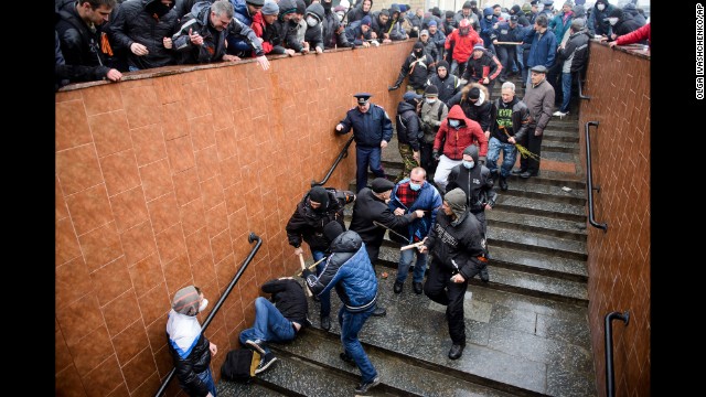 Pro-Russian supporters beat a pro-Ukrainian activist during a rally in Kharkiv, Ukraine, on Sunday, April 13.