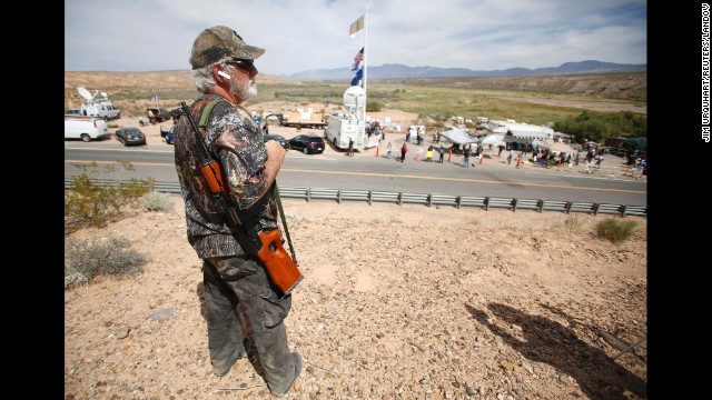 Brand Thornton carries a rifle at a protest site in Bunkerville on April 11. The controversy drew armed militia groups from across the country to Bundy's side. The Bureau of Land Management stopped rounding up Bundy's cattle on Saturday, April 12, and it says it returned about 300 head of cattle to the open range to avoid the potential for violence.