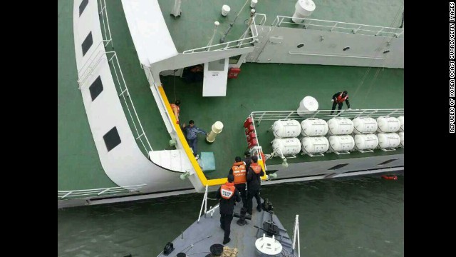 A passenger is rescued from the sinking ship on April 16.