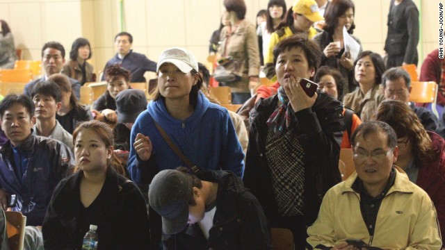 Parents at Danwon High School search for names of their children among the list of survivors. Ansan is a suburb of Seoul, the South Korean capital.