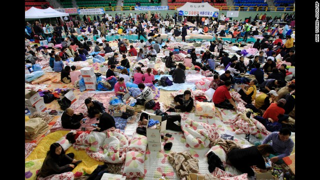 Family members of passengers aboard the sunken ferry gather at a gymnasium in Jindo on April 17.