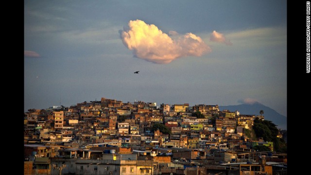 The sun rises over the favela, where soldiers and marines are reinforcing a police crackdown on criminal gangs ahead of the World Cup football tournament, which begins in June.