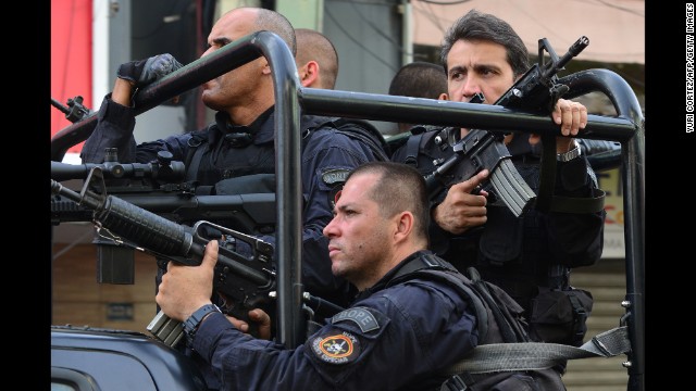 Officers patrol the streets of the Complexo da Mare in June 2013. The FIFA Confederations Cup soccer tournament was going on in Rio at the time.