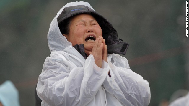 A woman cries as she waits for news on missing passengers April 18 in Jindo.