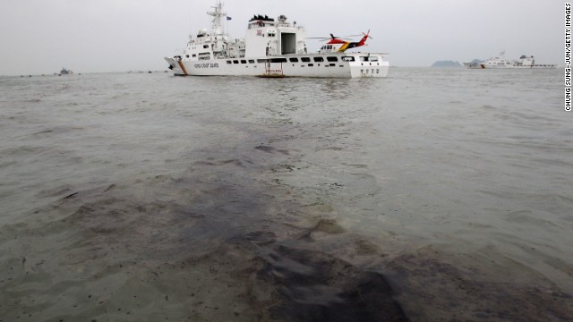 Oil from the sunken ferry appears near the wreckage site on April 19.