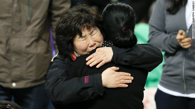 Family members of missing passengers hug as they await news of their missing relatives at Jindo Gymnasium in the southwestern province of South Jeolla, South Korea, on April 19. 