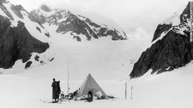 Mountaineers are seen preparing to leave their camp during one of Eric Shipton's early expeditions on Everest in the 1930s. While Shipton never made it to the summit, his exploration of the mountain paved the way for others. 