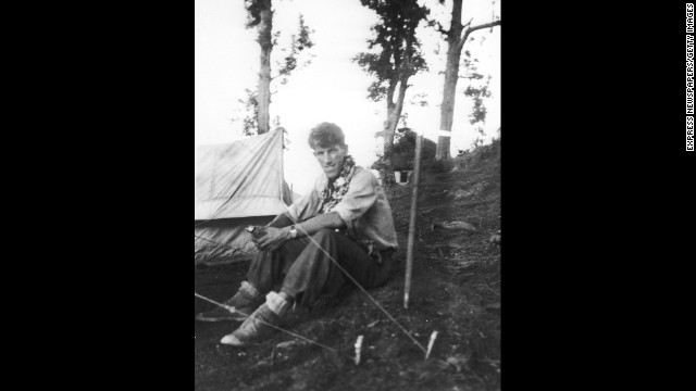 Edmund Hillary sits at base camp in May 1953 before heading out on what would become the first successful ascent to the top of the world. 