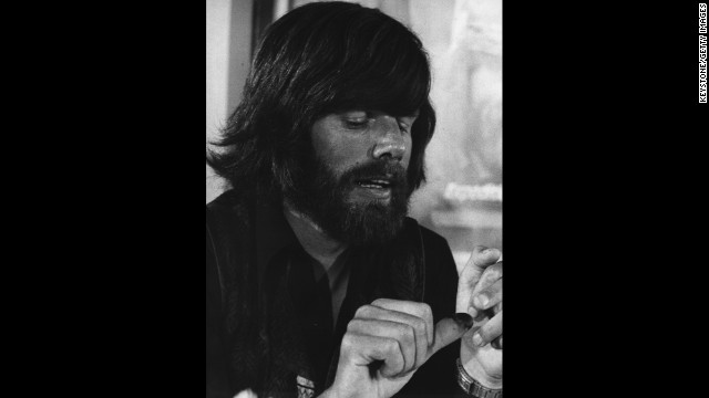 In 1978, Reinhold Messner makes the first ascent without supplemental oxygen. Messner is seen here at Munich Airport showing reporters his frozen thumb after climbing to the top of Nanga Parbat in Pakistan, alone and without an oxygen mask. 